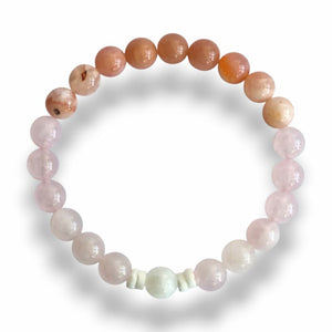 Handmade pink gradient stone bracelet with shell slice spacers on stretch cord, 7.5 inch