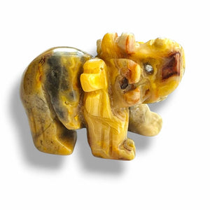 Carved stone elephant on a white background