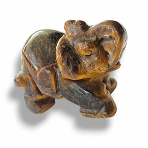 Carved elephant figure on a white background