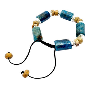 Blue gemstone bracelet featuring natural beads and adjustable closure.
