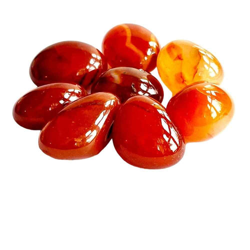 Carnelian polished tumblestone in warm orange-red natural stone