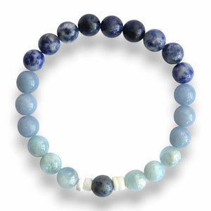 Handmade blue beaded bracelet with shell slice spacers on stretch cord, 8mm