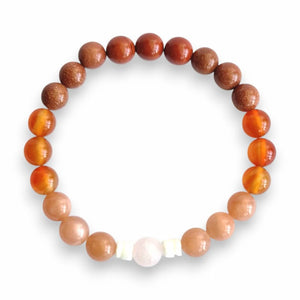 Handmade orange beaded bracelet with shell slice spacers on stretch cord, 7.5 inch