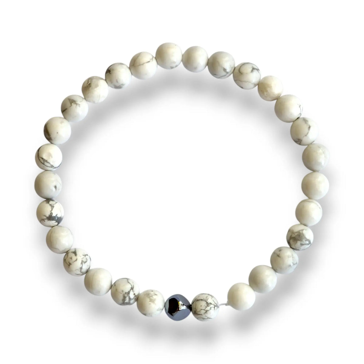 Howlite beaded bracelet with white 6mm beads veined in grey and one silver hematite cube accent