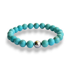 Turquoise howlite and hematite beaded bracelet with fine brown veining on a stretch cord, view 2