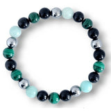 Malachite and black stone bracelet featuring shiny silver accents and a mix of green hues.
