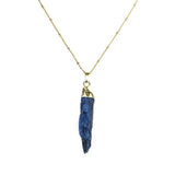 Lapis Lazuli Pendant Necklace featuring a gold chain and a striking blue stone.