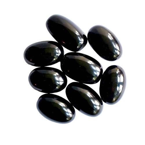 Black obsidian polished tumblestone, glossy black volcanic glass