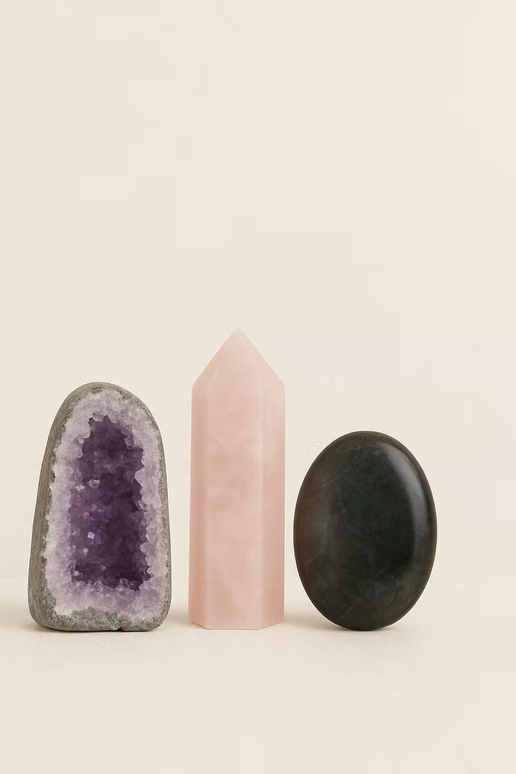 Three crystals on a beige background